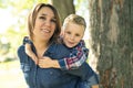 Happy family mother and child son playing on autumn park Royalty Free Stock Photo