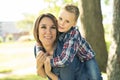 Happy family mother and child son playing on autumn park Royalty Free Stock Photo