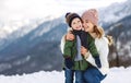 Happy family mother and child playing on winter walk Royalty Free Stock Photo