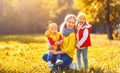 Happy family mother and children on autumn walk Royalty Free Stock Photo