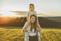 Happy family mother with children daughter on nature sunset Royalty Free Stock Photo