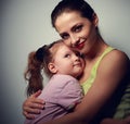 Happy family. Mother cuddling daughter with love Royalty Free Stock Photo