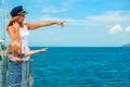 Happy family - mother, daughter on board of sailing yacht.