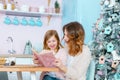 Happy family mother and daughter celebrating Merry Christmas and Happy New Year Royalty Free Stock Photo