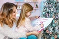 Happy family mother and daughter celebrating Merry Christmas and Happy New Year Royalty Free Stock Photo