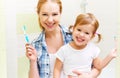 happy family mother and daughter child brushing her teeth toothbrushes Royalty Free Stock Photo