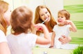 happy family mother and daughter child brushing her teeth toothbrushes Royalty Free Stock Photo