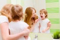 happy family mother and daughter child brushing her teeth toothbrushes Royalty Free Stock Photo