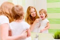 happy family mother and daughter child brushing her teeth toothbrushes Royalty Free Stock Photo