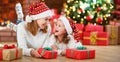 Happy family mother and daughter giving christmas gift Royalty Free Stock Photo