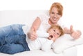 Happy family: mother and daughter have fun - thumbs up - on whit