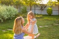 Happy family mother and daughter hugging in summer on the nature Royalty Free Stock Photo