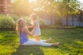 Happy family mother and daughter hugging in summer on the nature Royalty Free Stock Photo