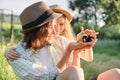 Happy family mother with daughter in nature, woman holding small newborn baby chicks in hands, farm, country rustic style Royalty Free Stock Photo