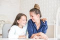 Happy family mother and daughter read a book in the evening at home. the concept of family comfort and family relations Royalty Free Stock Photo