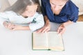 Happy family mother and daughter read a book in the evening at home. the concept of family comfort and family relations Royalty Free Stock Photo