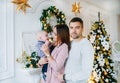 Happy family mother, father and adorable baby son celebrating Christmas Royalty Free Stock Photo