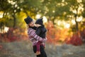 Happy family mother father and baby on autumn walk in the park Royalty Free Stock Photo