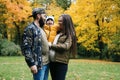 Happy family mother father and baby on autumn walk in the park Royalty Free Stock Photo