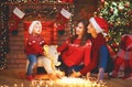 Happy family mother father and baby at christmas tree at home Royalty Free Stock Photo