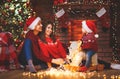 Happy family mother father and baby at christmas tree at home Royalty Free Stock Photo