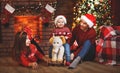 Happy family mother father and baby at christmas tree at home Royalty Free Stock Photo