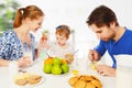 Happy family mother, father, child baby daughter having breakfast Royalty Free Stock Photo