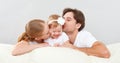 Happy family mother, father, child baby daughter at home on sofa playing and laughing Royalty Free Stock Photo