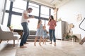 Happy family mother father and child daughter dancing at home. Royalty Free Stock Photo