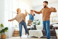 Happy family mother father and child daughter dancing at home Royalty Free Stock Photo