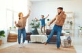 Happy family mother father and child daughter dancing at home Royalty Free Stock Photo