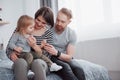 Happy family mother, father and child daughter laughs in bed Royalty Free Stock Photo