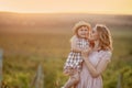 Happy family: mother father and child daughter on nature on sunset Royalty Free Stock Photo