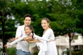 Happy family: mother, father, child daughter at park. Family relaxing on holiday Royalty Free Stock Photo