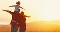 Happy family: mother father and child daughter on sunset Royalty Free Stock Photo