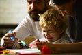 Happy family mother, father and child. Happy family with children drawing on weekend. Kid learning painting, little Royalty Free Stock Photo