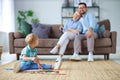 Happy family mother father and child son draw together at home Royalty Free Stock Photo