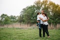 Happy family: mother father and child son on nature on sunset. Mom, Dad and kid laughing and hugging, enjoying nature Royalty Free Stock Photo