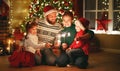 Happy family   celebrate Christmas and new year, light sparklers Royalty Free Stock Photo