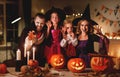 Happy family mother father and children in costumes and makeup on  Halloween Royalty Free Stock Photo