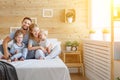 Happy family mother father and children daughter and son in bed Royalty Free Stock Photo