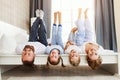 Happy family mother, father and children laughing, playing and smiling in bed   at home Royalty Free Stock Photo