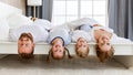 Happy family mother, father and children laughing, playing and smiling in bed   at home Royalty Free Stock Photo