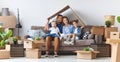 Happy family mother father and children move to new apartment an Royalty Free Stock Photo