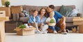 Happy family mother father and children move to new apartment an Royalty Free Stock Photo