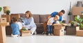 Happy family mother father and children move to new apartment an Royalty Free Stock Photo