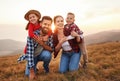 Happy family: mother, father, children son and daughter on nature on sunset Royalty Free Stock Photo