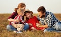 Happy family: mother, father, children son and daughter on nature on sunset Royalty Free Stock Photo