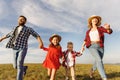 Happy family: mother, father, children son and daughter on nature  on sunset Royalty Free Stock Photo