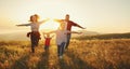 Happy family: mother, father, children son and daughter on sunset Royalty Free Stock Photo